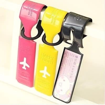 Waf Store Lebanon set of three colourful PVC luggage tags in pink, yellow, and black with airplane icons