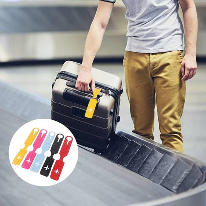 Waf Store Lebanon flexible PVC luggage tags in assorted colors with airplane icons attached to a suitcase at an airport