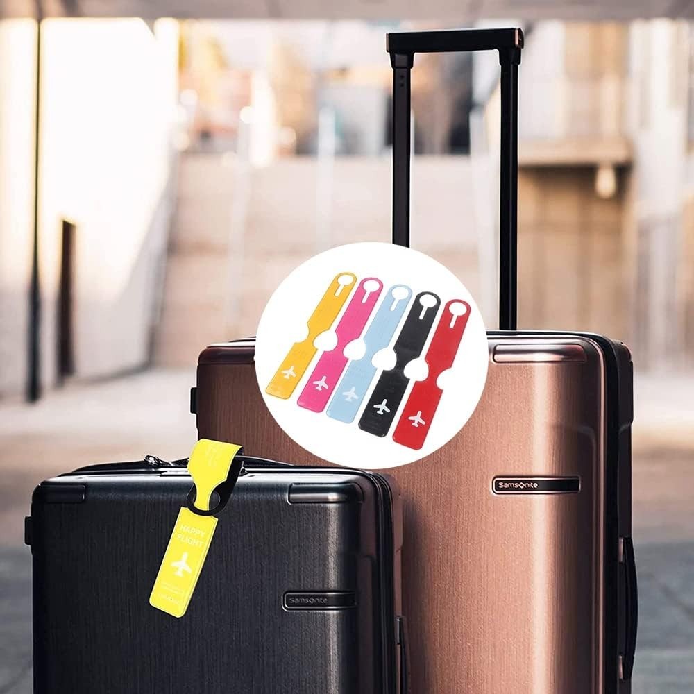 Waf Store Lebanon flexible PVC luggage tags in assorted colors with airplane icons attached to travel suitcases