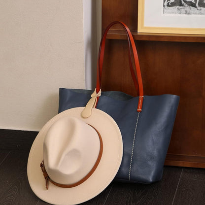 Waf Store Lebanon beige silicone hat clip attaching a fedora to a blue leather tote bag for travel and storage