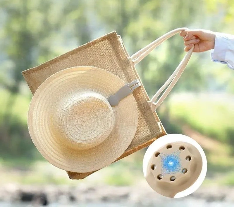 Waf Store Lebanon beige silicone hat clip attached to a straw hat on a jute tote bag for travel and storage