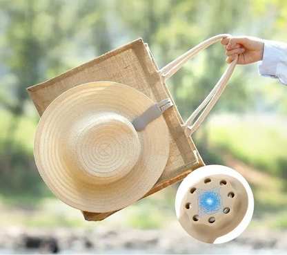 Waf Store Lebanon beige silicone hat clip attached to a straw hat on a jute tote bag for travel and storage