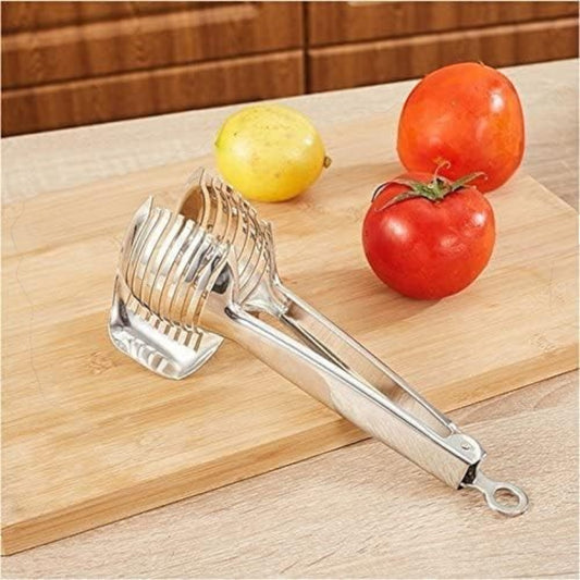 Waf Store Lebanon stainless steel lemon and tomato slicer with an ergonomic clamp design on a wooden cutting board.