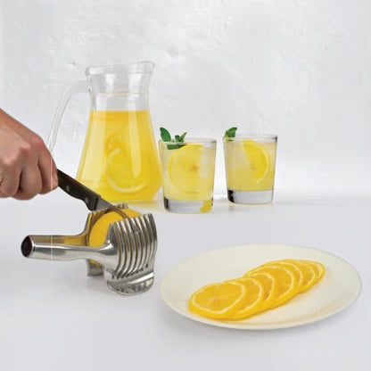 Waf Store Lebanon stainless steel lemon slicer holding a lemon with a knife, next to lemonade and sliced lemons.