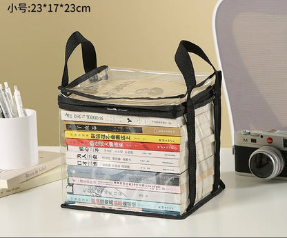 Waf Store Lebanon transparent PVC storage case with black trim and handles, holding a stack of books on a desk.