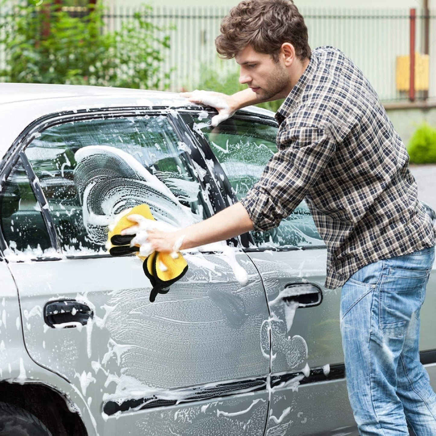 Waf Store Lebanon microfiber car wash towel in yellow with black silk edges being used to clean a silver car