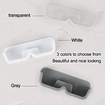 Wall mounted sunglasses holder available in transparent, white and gray