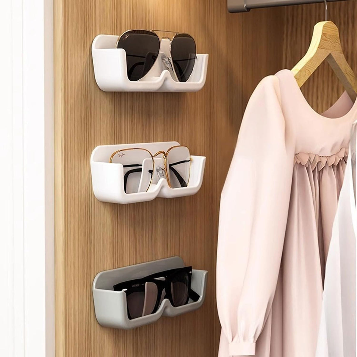 Wall mounted sunglasses holder keeping glasses safe and in view