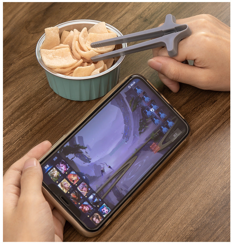 Snack chopsticks worn on the index finger